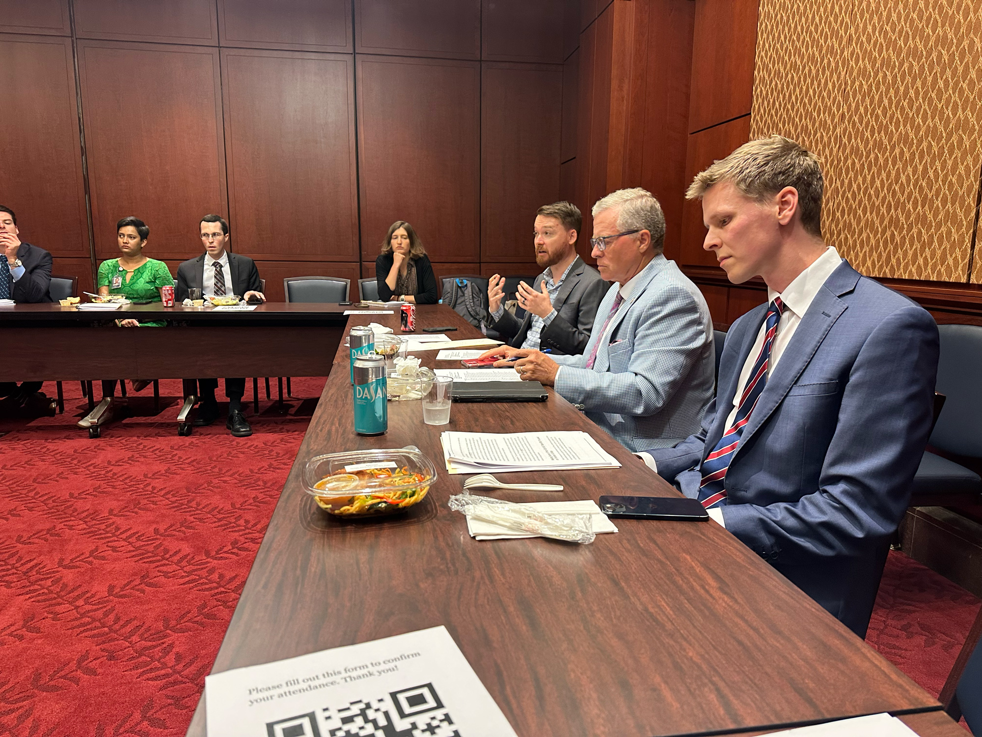 Alasdair Phillips-Robins and Jon Bateman briefed staff at an Aspen Institute lunch on AI. Former Rep Charlie Dent moderated, July 2025