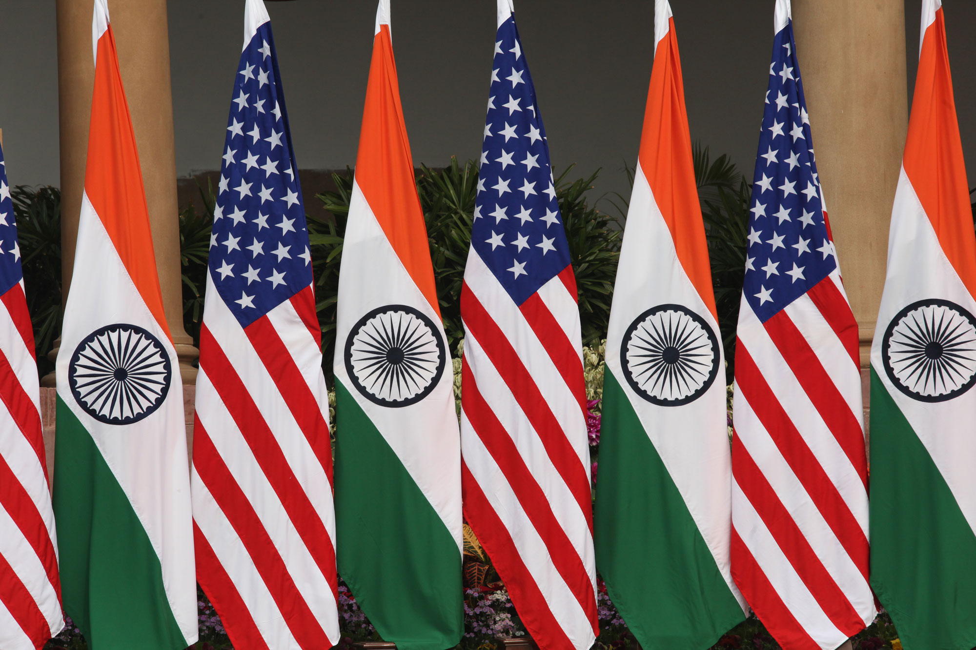 U.S. and Indian flags on display.