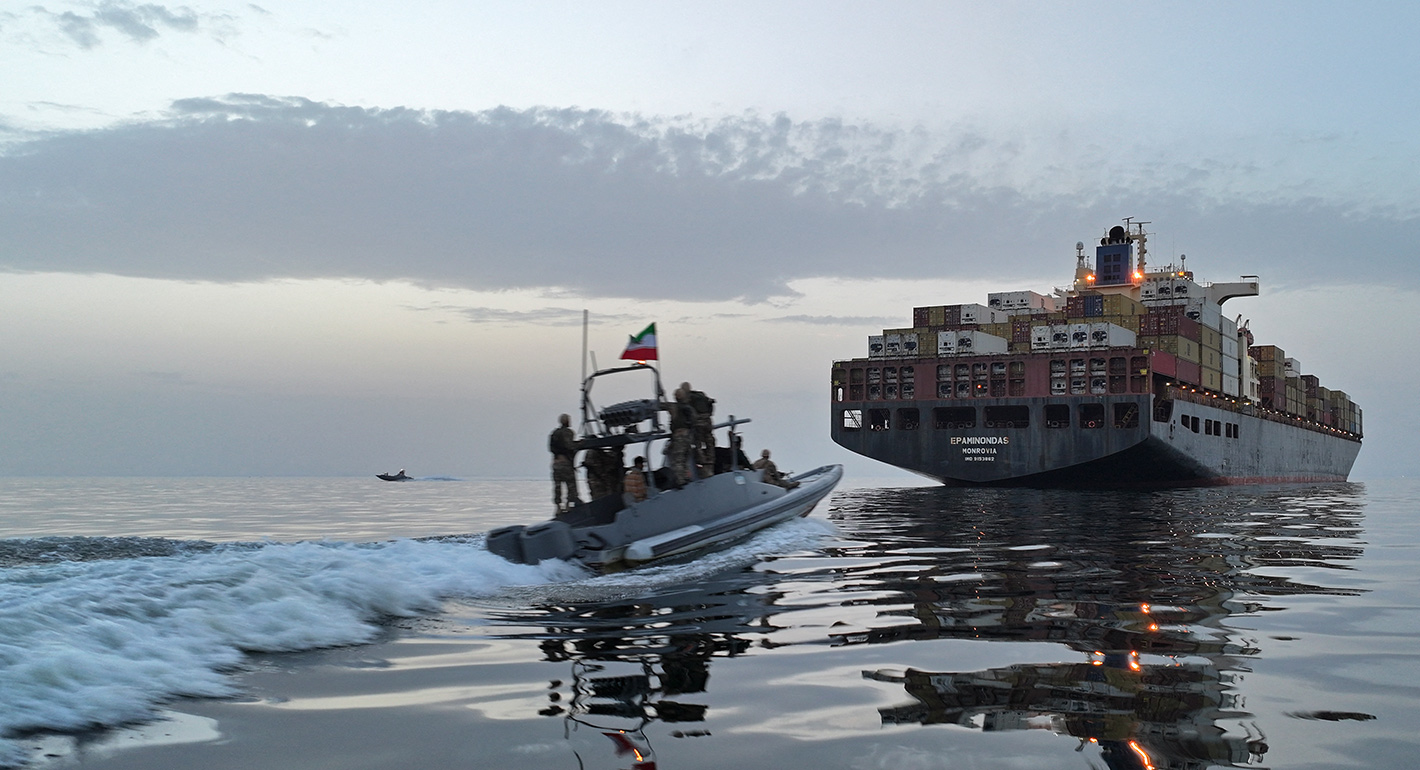 This photo obtained by AFP from the Iranian news agency Tasnim shows an Islamic Revolutionary Guard Corps (IRGC) boat allegedly taking part in an operation to seize ships attempting to cross the Strait of Hormuz, on April 21, 2026. 