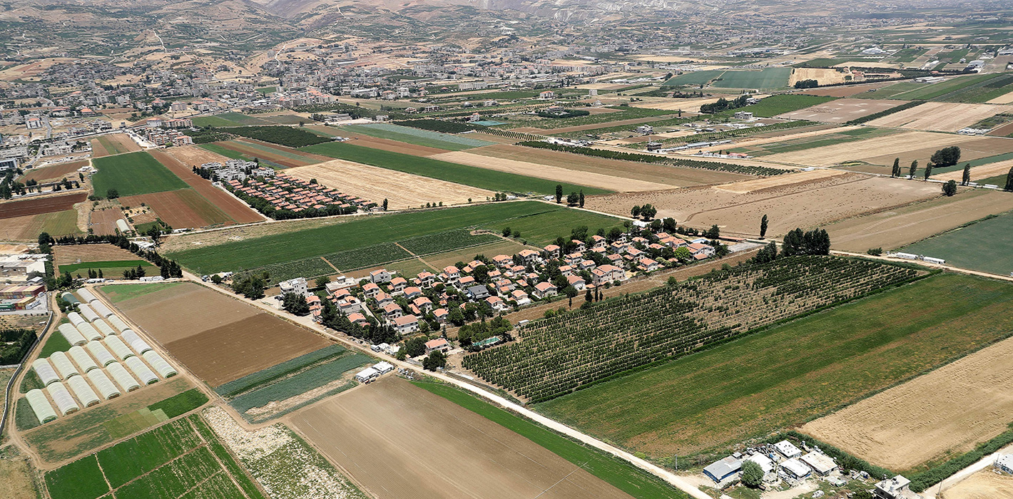 This picture taken on July 1, 2021 during a press tour provided by the Lebanese Air Force shows an aerial view of agricultural fields in Lebanon's eastern Bekaa Valley. -
