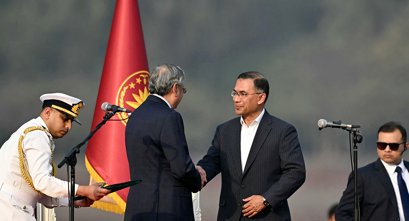 Bangladesh's newly sworn-in Prime minister Tarique Rahman (2R) shakes hands with President Mohammed Shahabuddin during a swearing-in ceremony at the National Parliament building in Dhaka on February 17, 2026