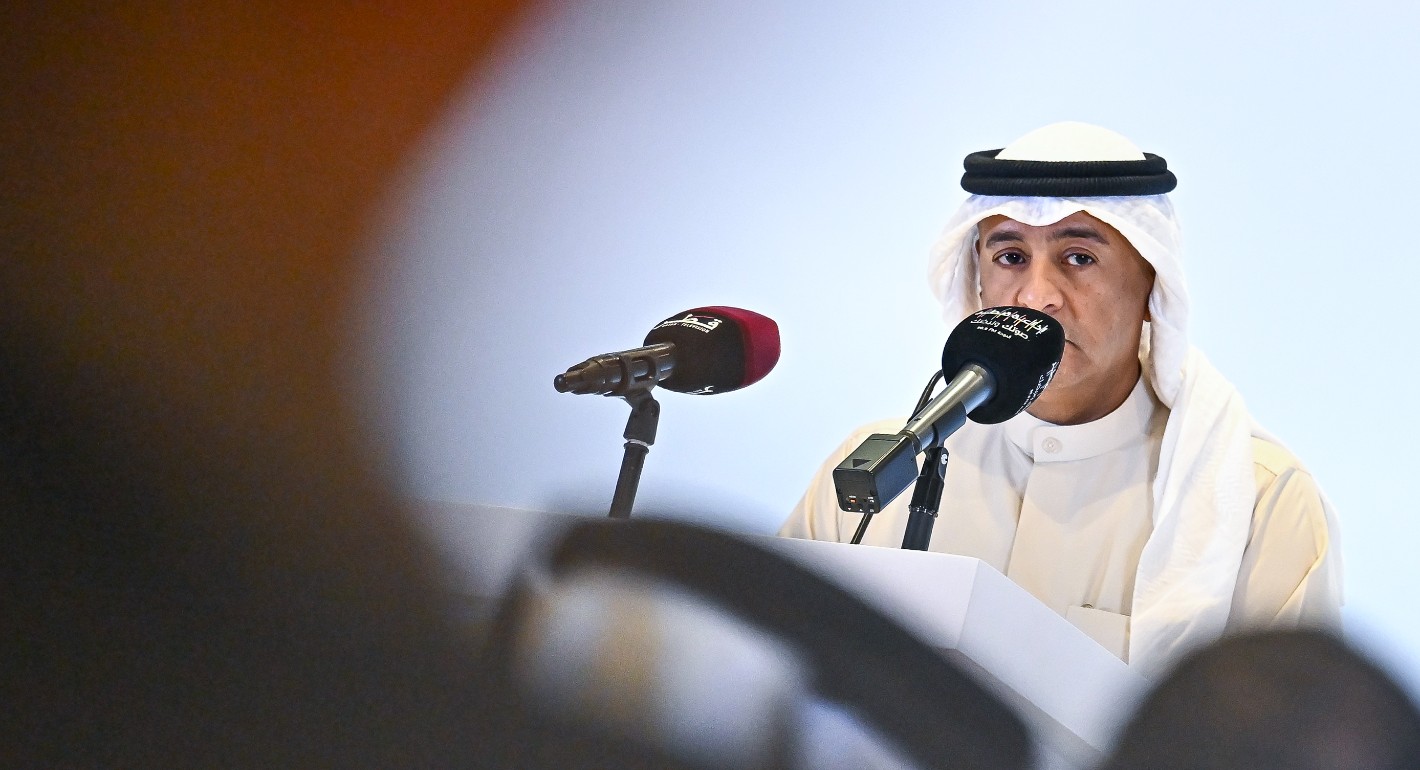 Man speaking into two mics