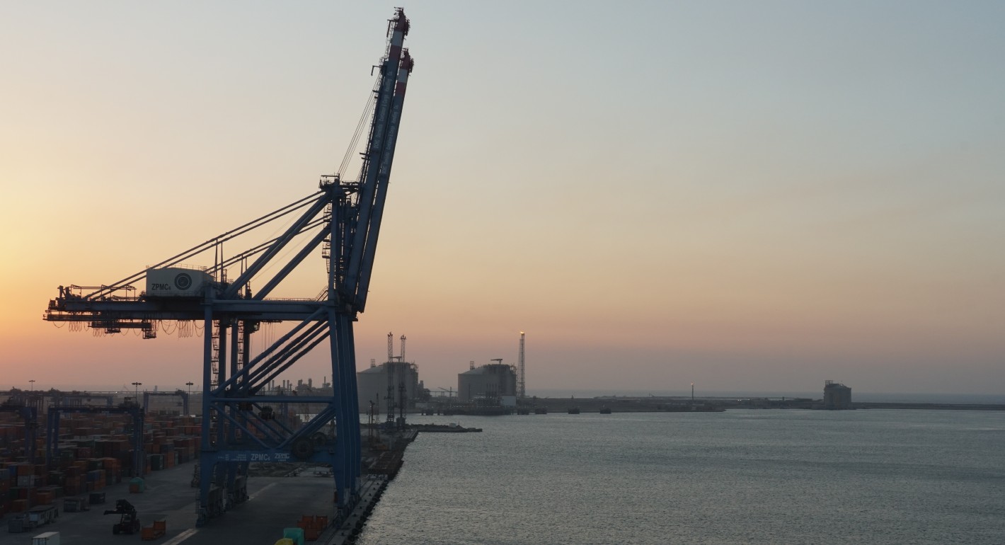 Port cranes at sunset