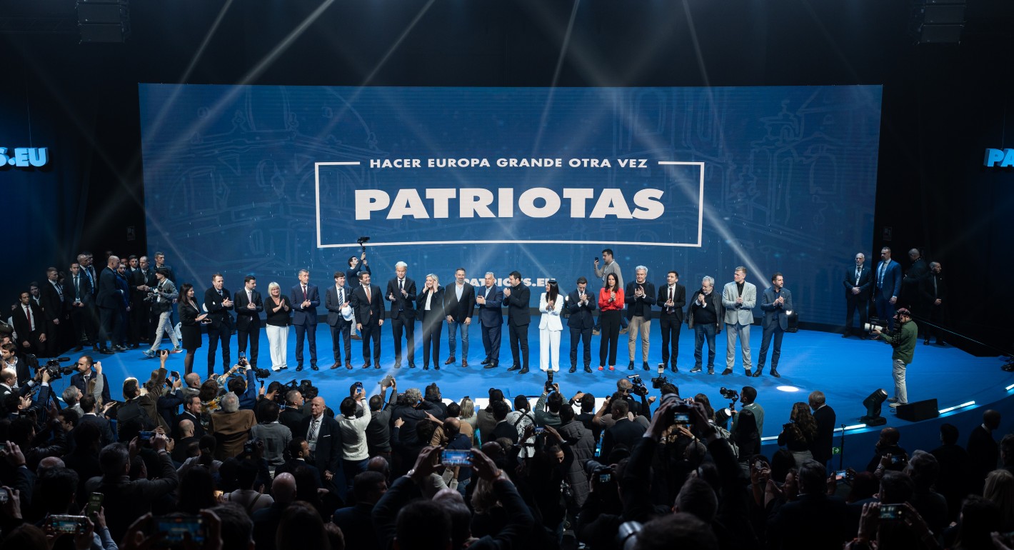 Wide shot of people standing on a stage