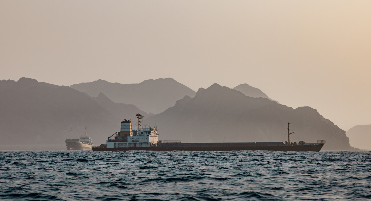 Photo of commercial ship anchored near the Strait of Hormuz.