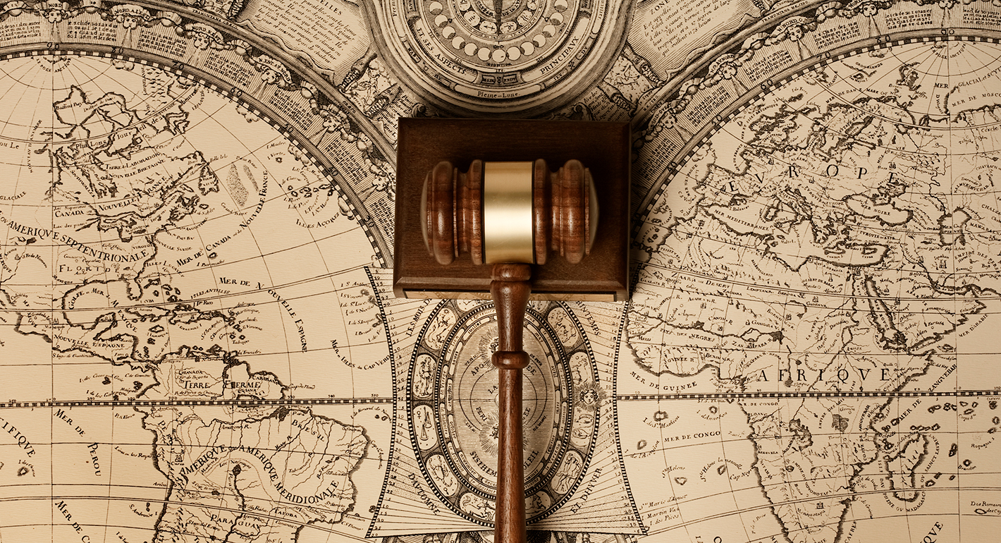 Gavel on old world map