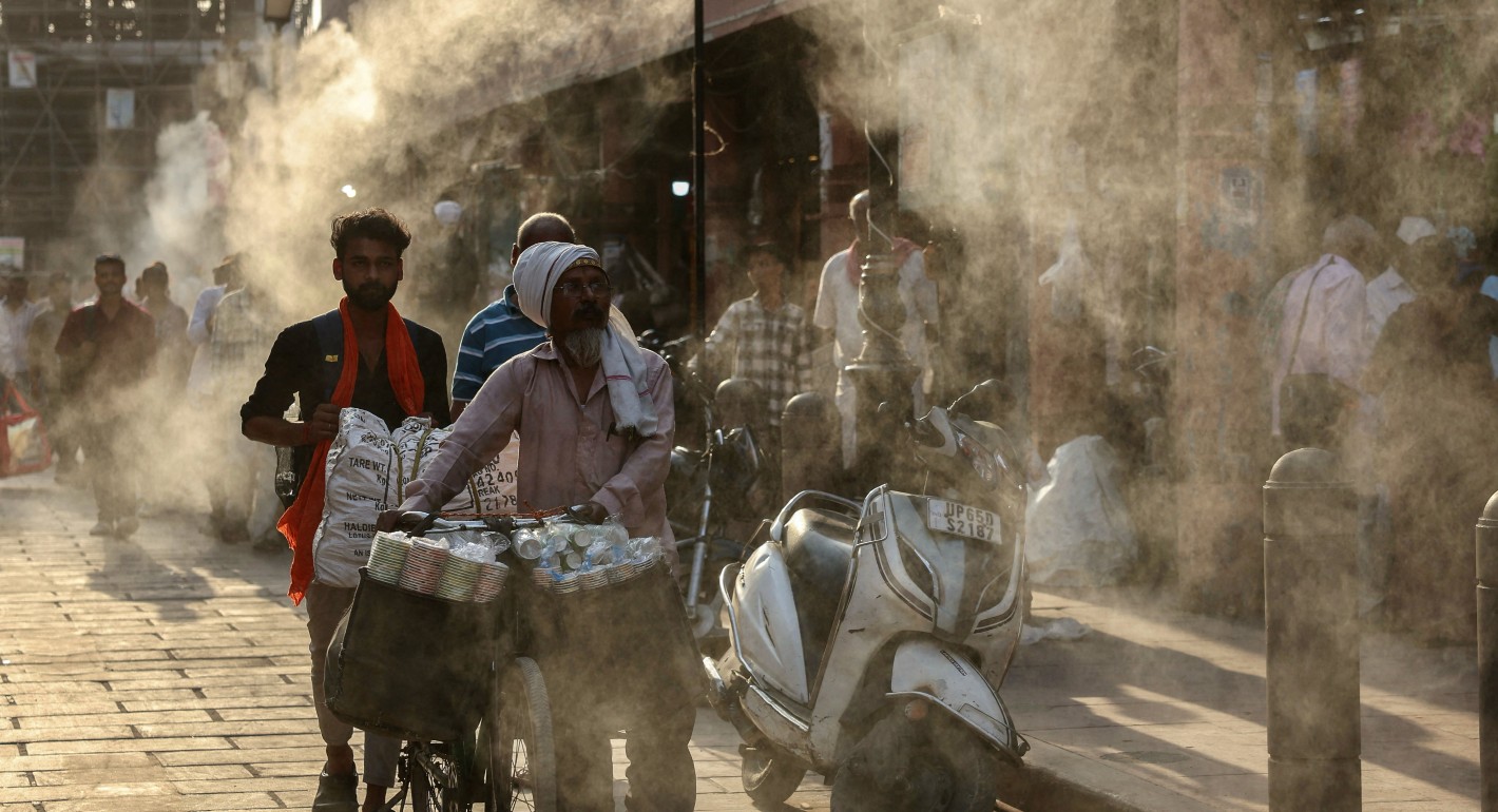 Pedestrians passing through mist