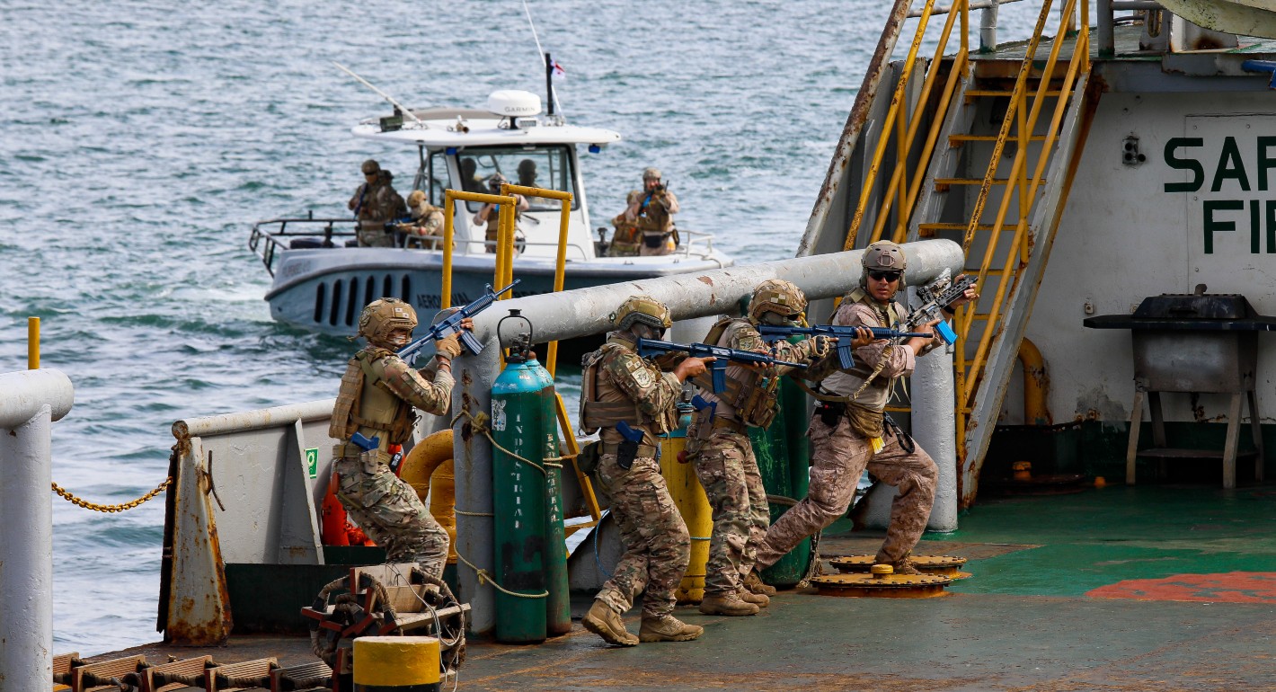 military personnel on a boat