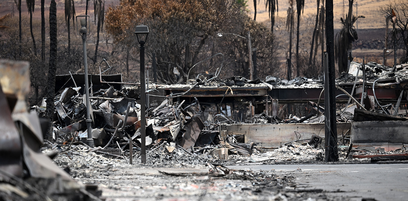 Fire damage is pictures as US President Joe Biden (out of frame) visits to an area devastated by wildfires in Lahaina, Hawaii on August 21, 2023. 