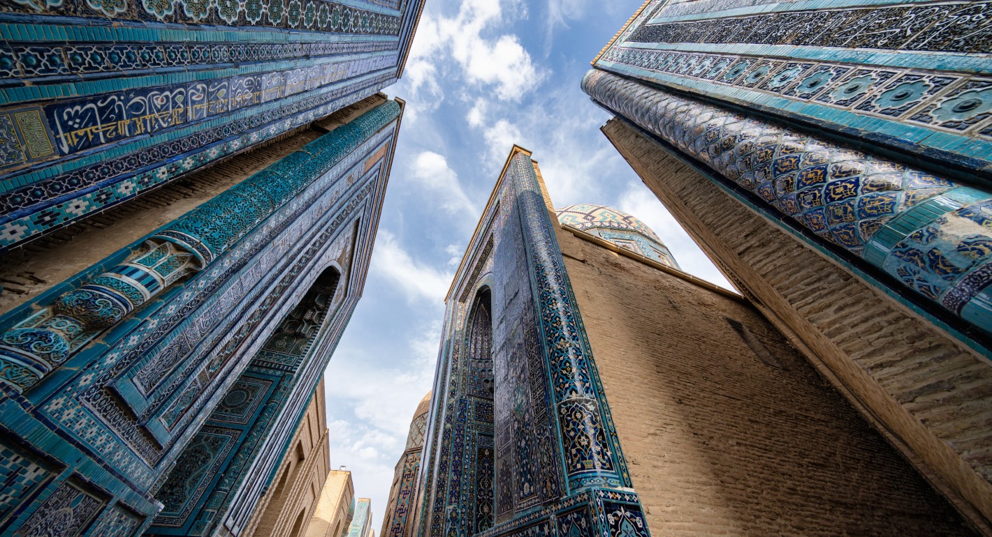 upward-facing view of ornately tiled buildings