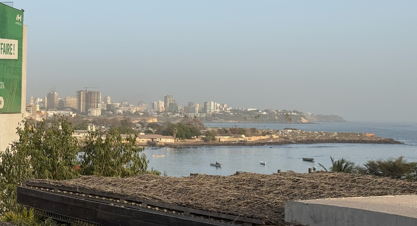 wide shot of the city of Dakar by the water