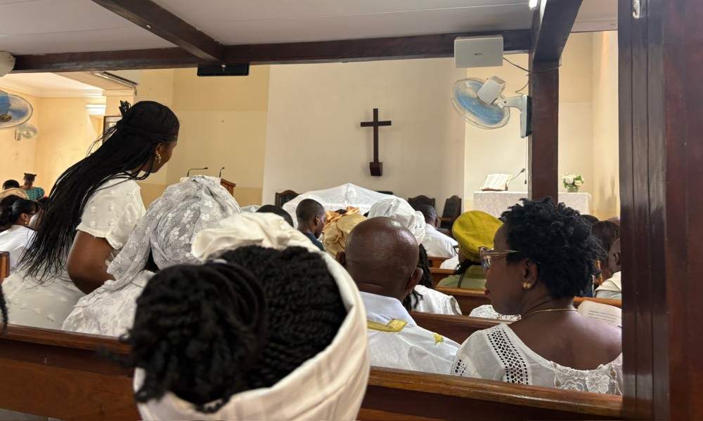 the backs of heads of people in a church