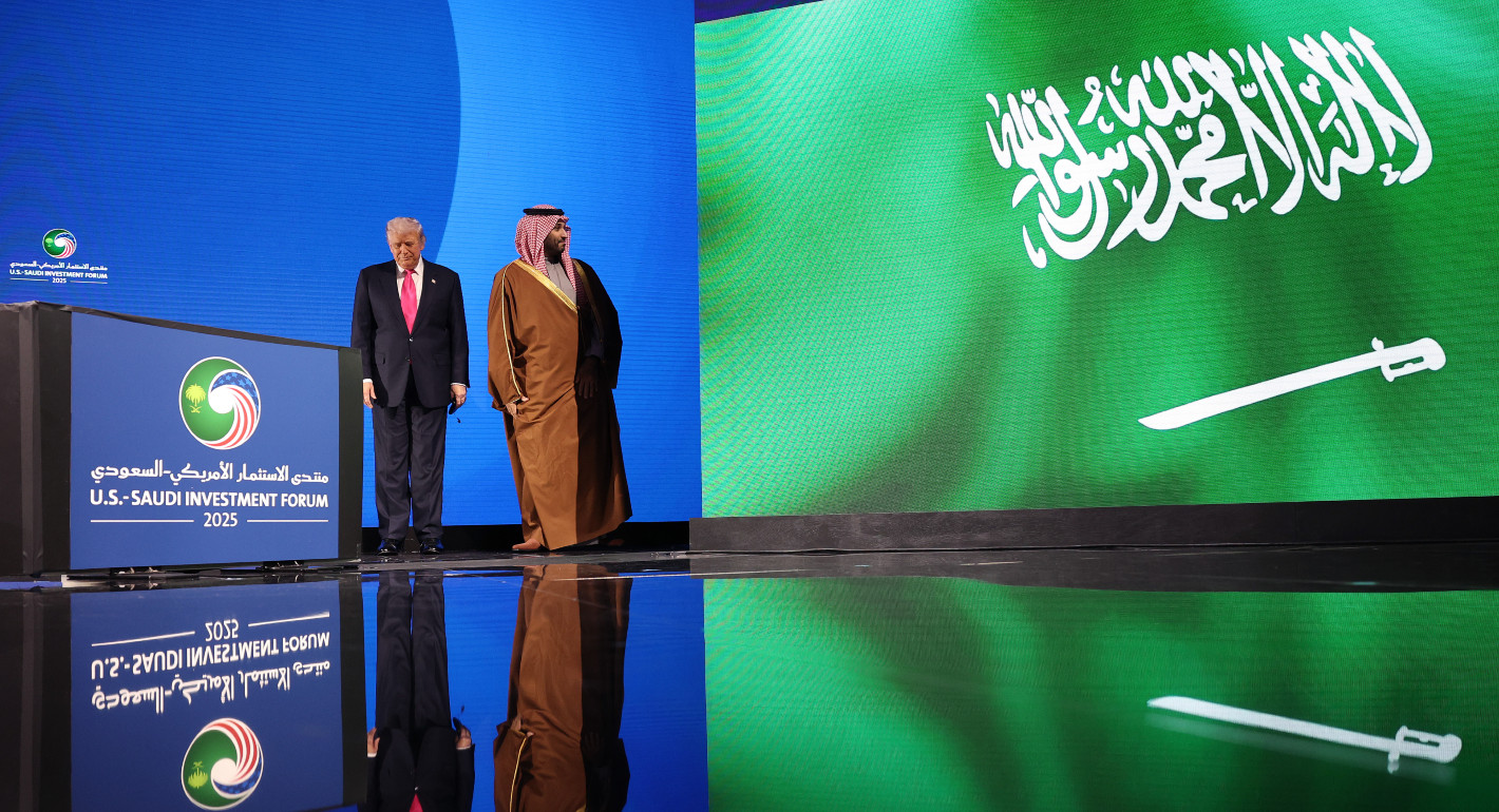 Trump and MBS walking across a stage