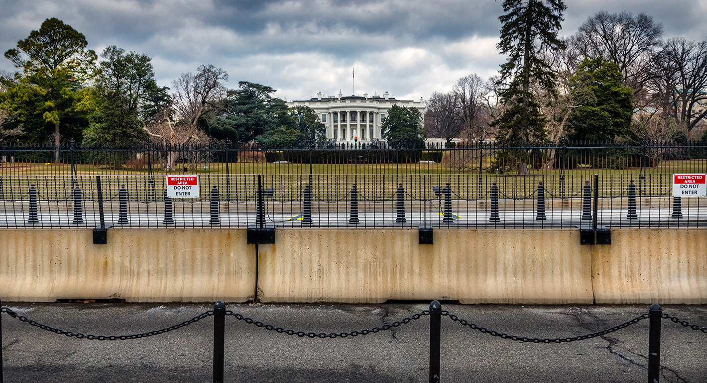 White House fences and stormy weather
