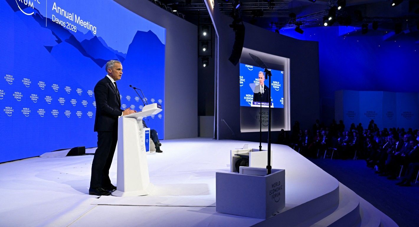 Carney speaking on stage