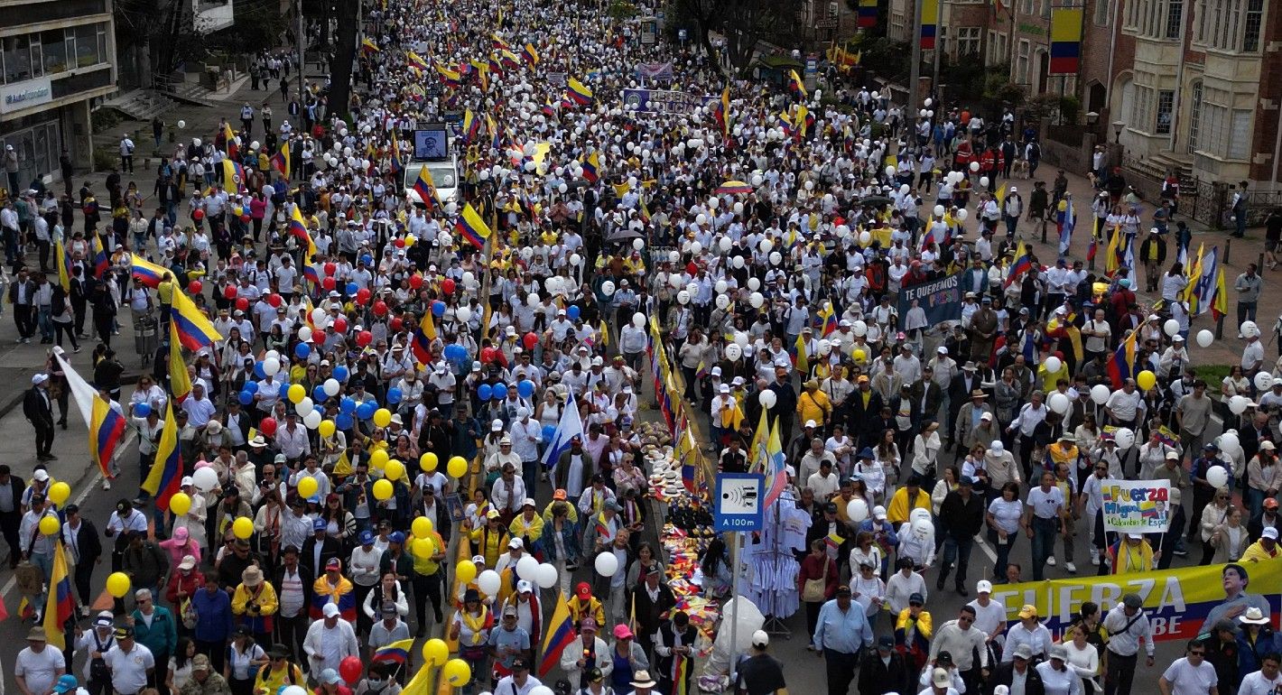 overhead shot of people marching through a city street