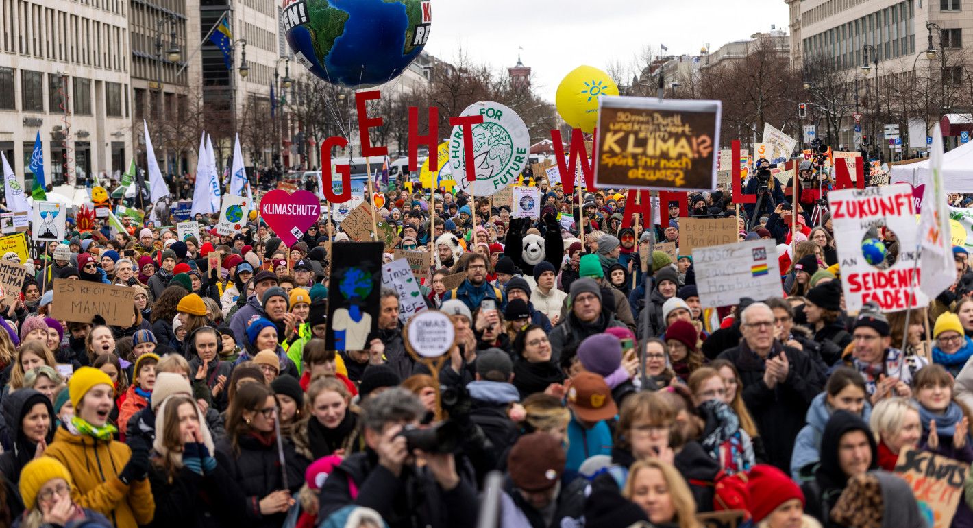 people marching holding signs