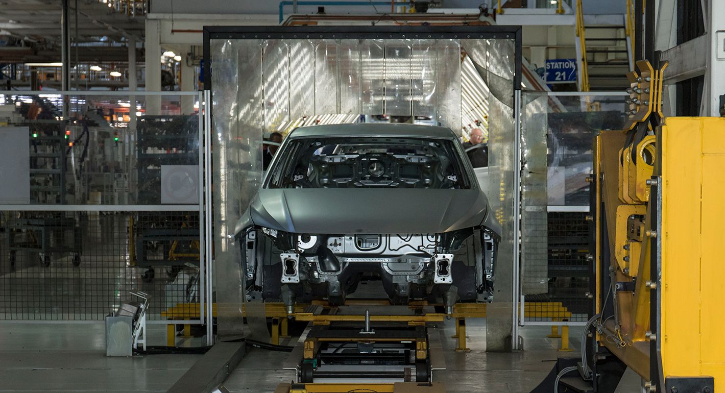 Workers of automotive manufacturer VW assemble pieces of a model in the Uitenhage plant. 