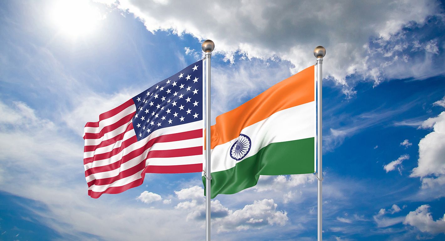 Waving flags of America and India