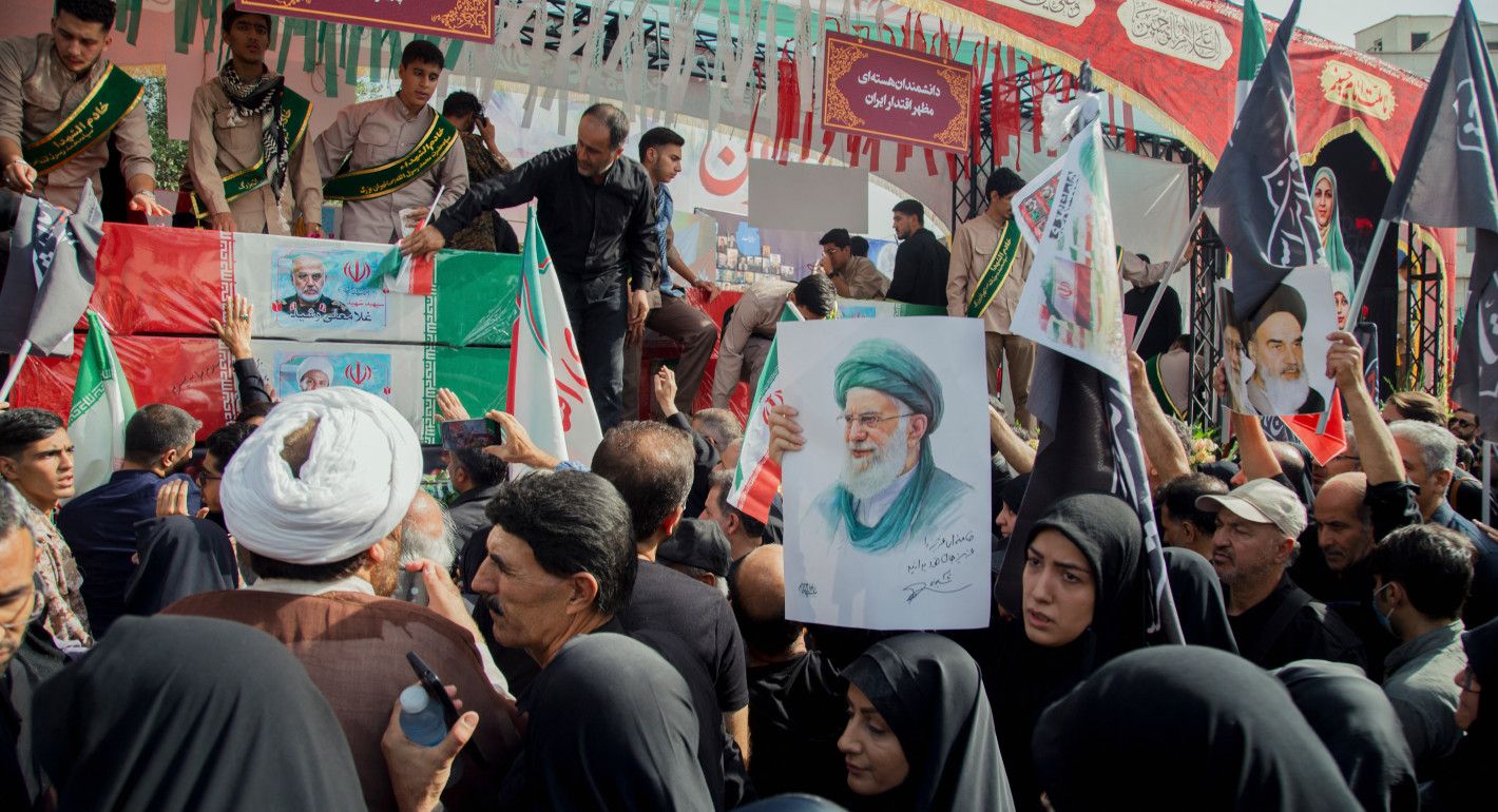 People holding posters and walking