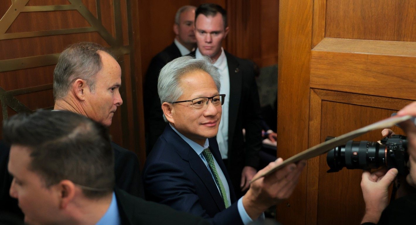 Huang being handed a piece of paper