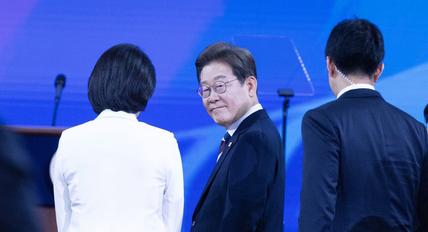 Lee turning and smiling at the camera