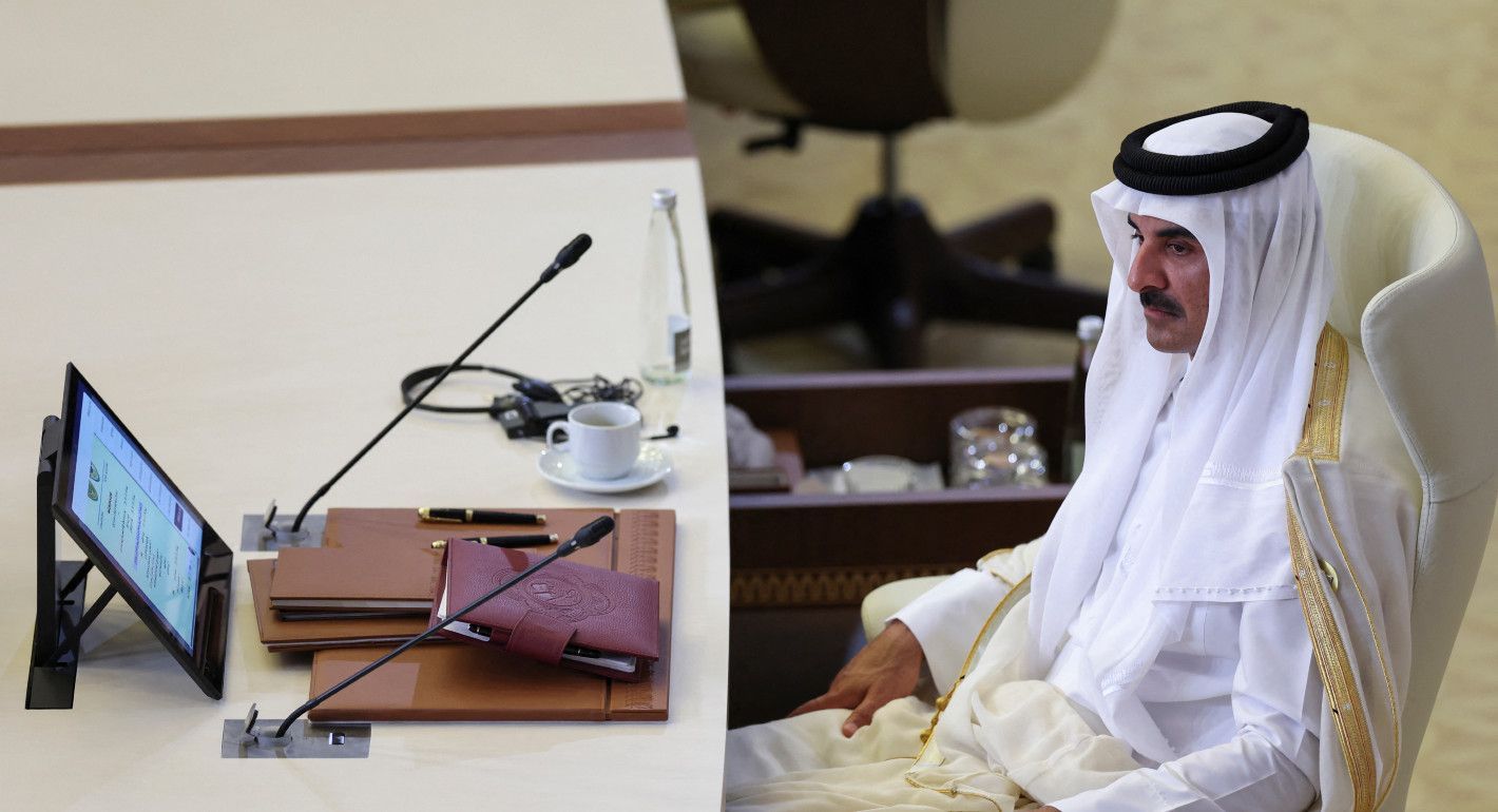 Tamim sitting behind a mic at a table