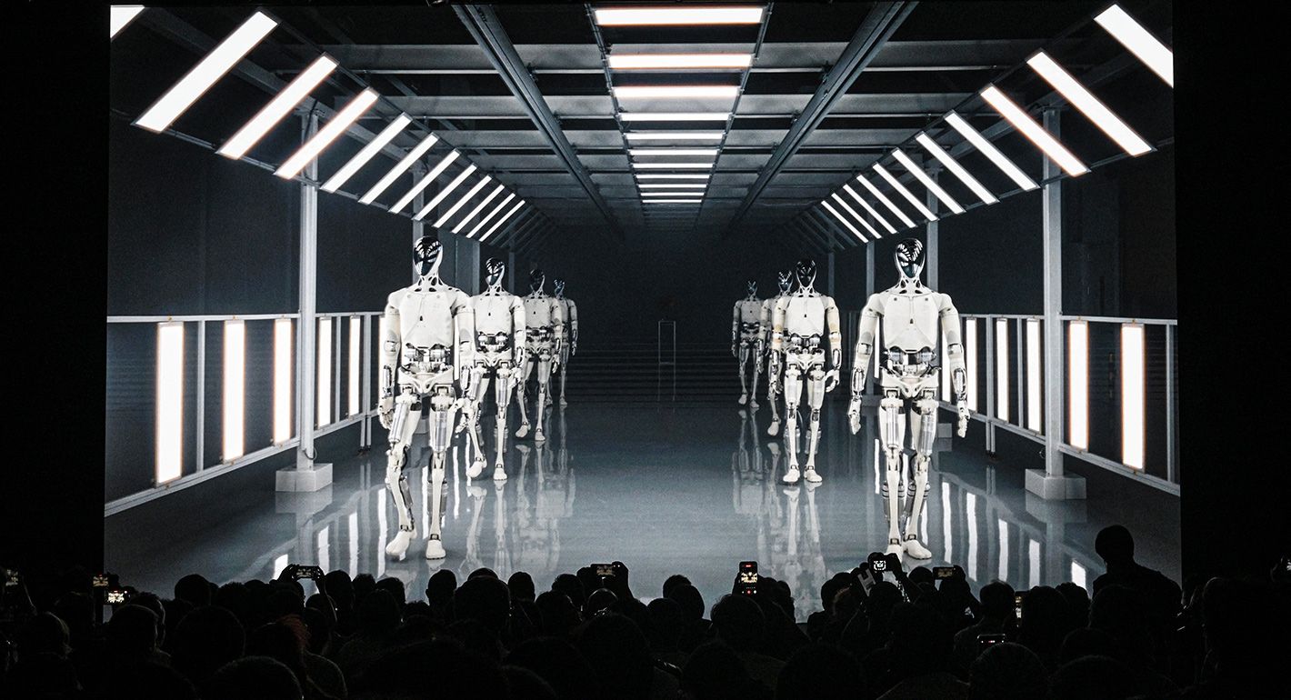 People look at a video clip of Xpeng's next-gen Iron humanoid robot during AI Day at its headquarter in Guangzhou, in southern China's Guangdong province on November 5, 2025.