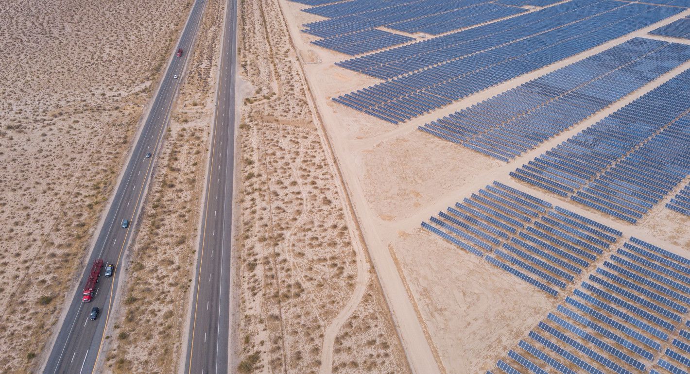 highway on the left and solar panels on the right