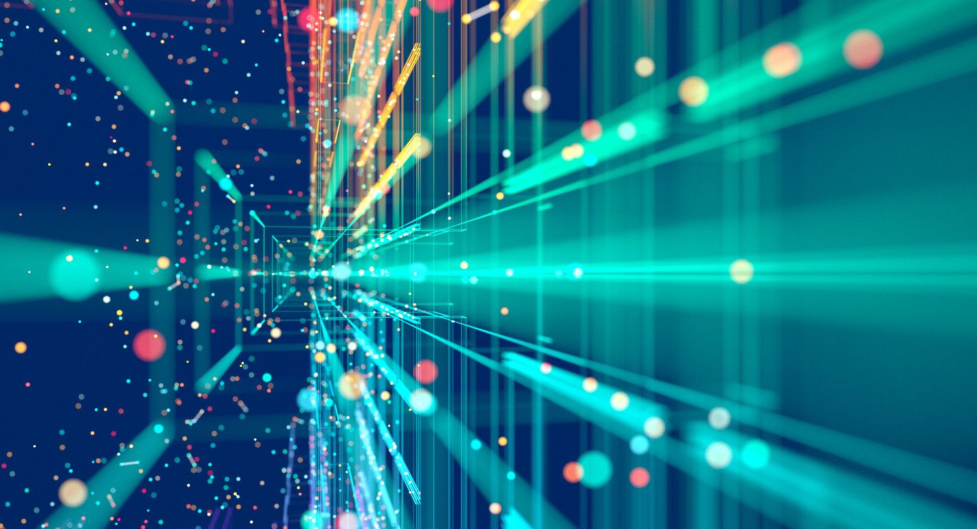 A stock image of bright teal blue and yellow lines of light angled toward you on a dark blue background