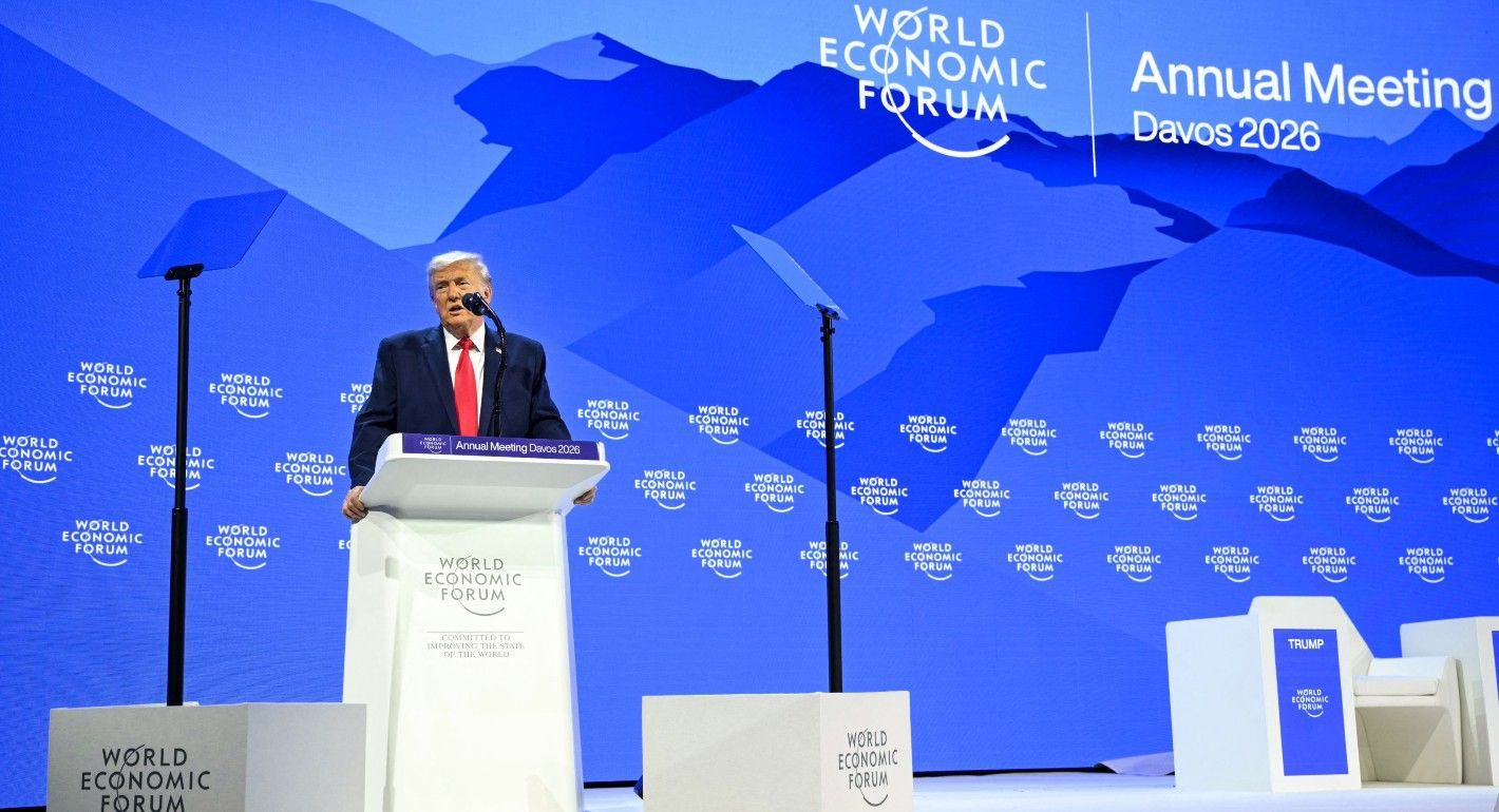 Trump speaking on a stage