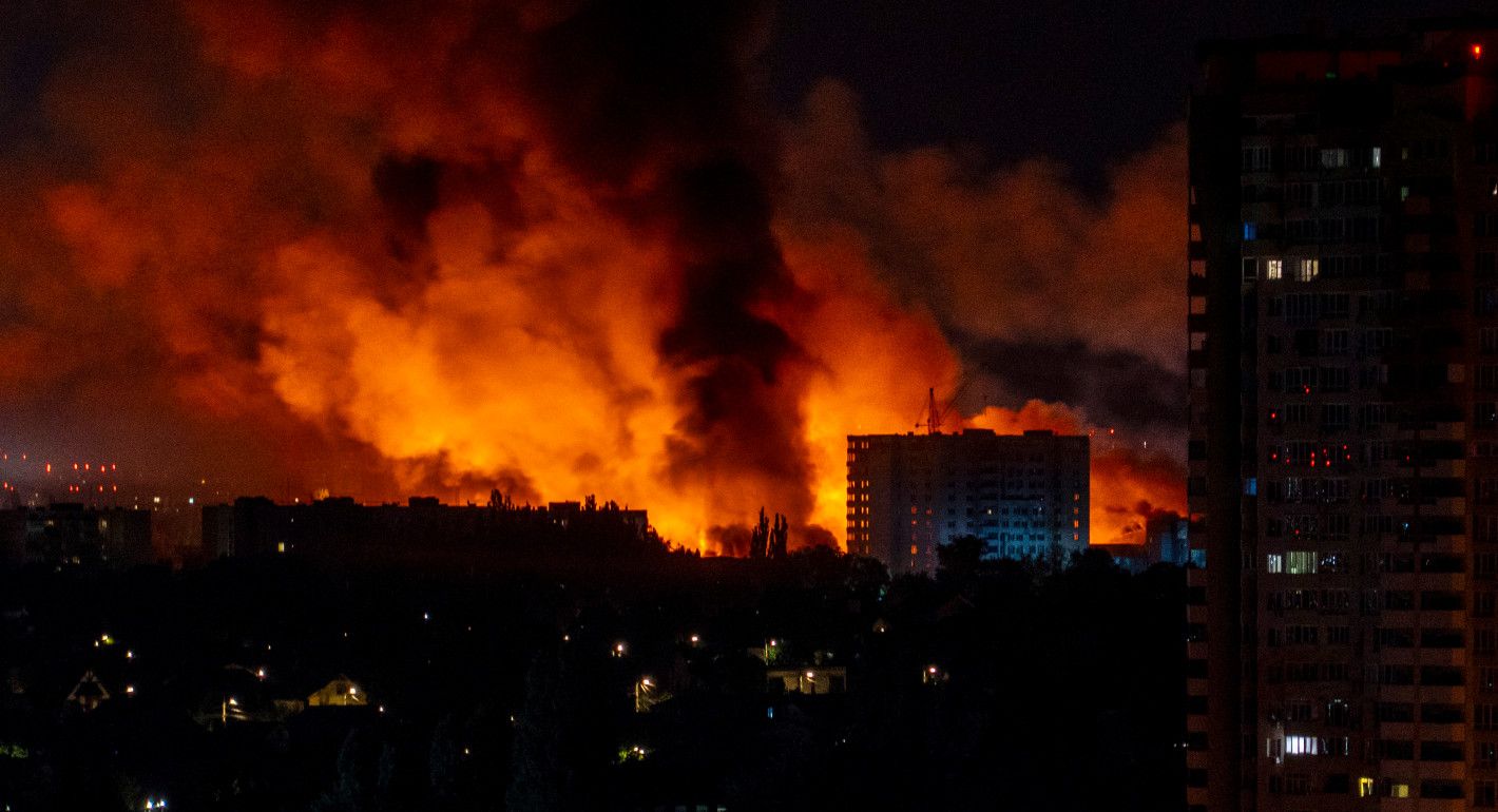 Buildings on fire at night