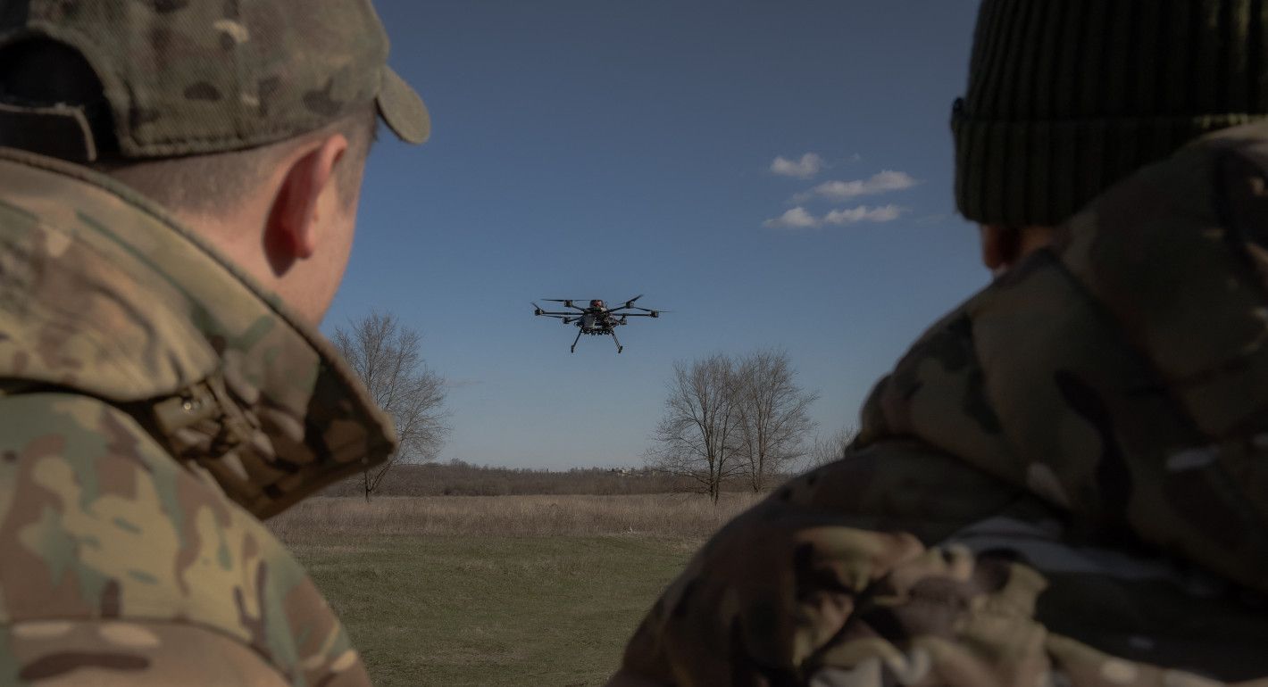 Photo of Ukrainian soldiers operating a drone.